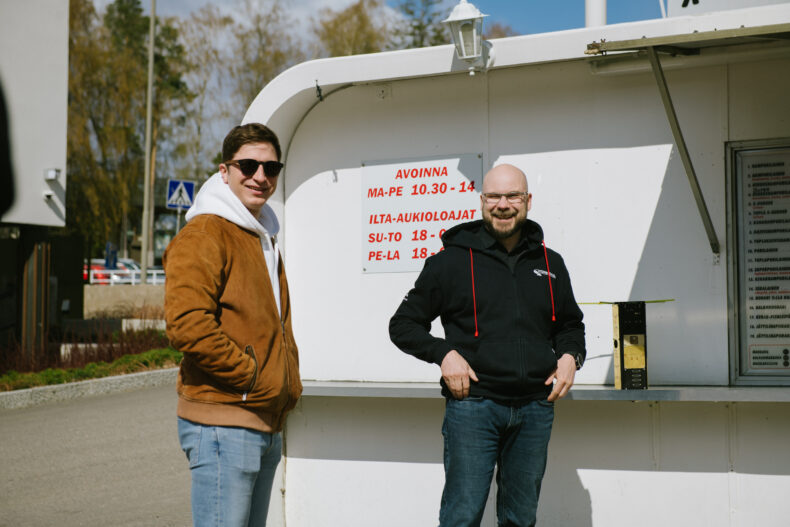The image features two people who smile and look at the camera.